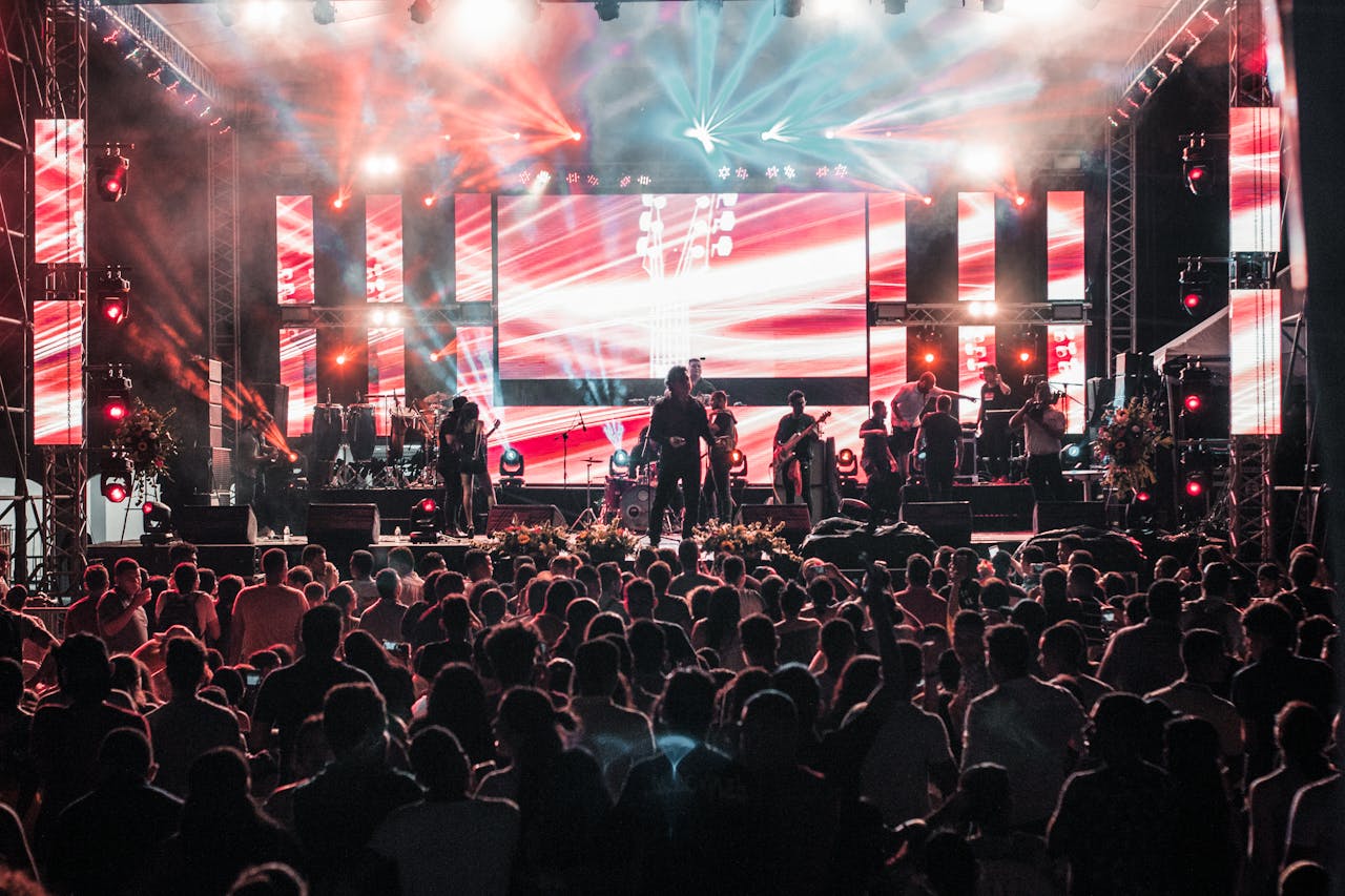 Crafting Captivating Headlines: Your awesome post title goes here Vibrant outdoor concert event in Santa Marta with a lively crowd and colorful lighting effects.
